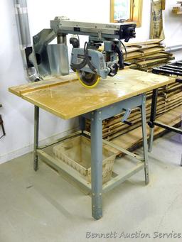 Delta Model 10 Deluxe Radial Arm Saw with Automatic Brake with single phase ball bearing motor. Has