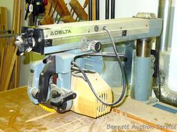 Delta Model 10 Deluxe Radial Arm Saw with Automatic Brake with single phase ball bearing motor. Has