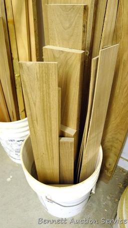 Bucket of lumber pieces, largest is 5" x 51", butternut or similar.