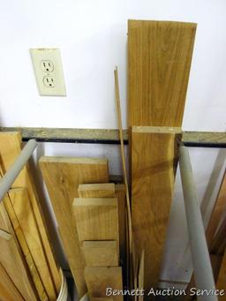 Bucket of lumber pieces, largest is 5" x 51", butternut or similar.