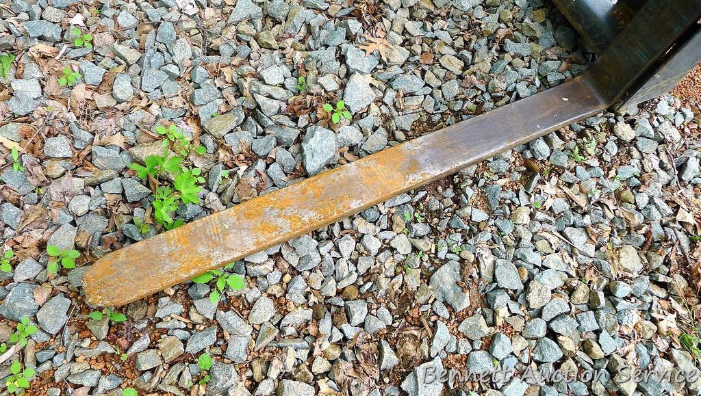 Quick connect pallet forks for Bobcat or other skid steer. Forks are 4' long, 4" wide. Back board is