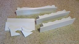 Five white shelves - great accent for just about any room. Longest is 24". All feel sturdy and look