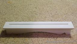 Five white shelves - great accent for just about any room. Longest is 24". All feel sturdy and look
