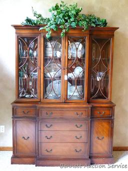 Beautiful antique china hutch is in good condition, glass and trim are intact. Measures 6'8" high x