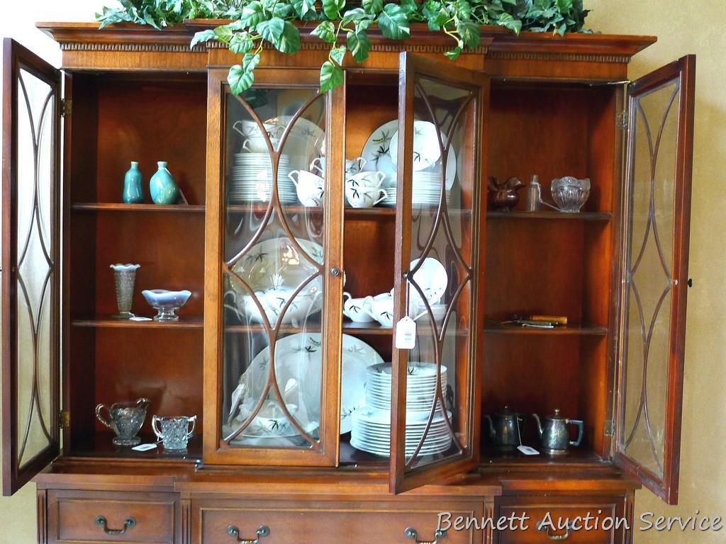 Beautiful antique china hutch is in good condition, glass and trim are intact. Measures 6'8" high x