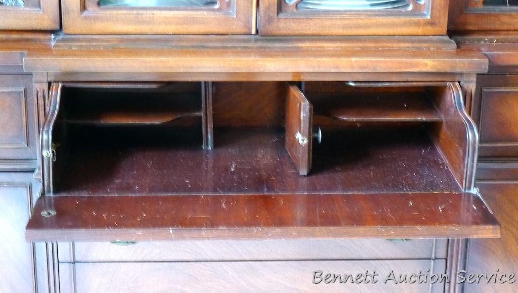 Beautiful antique china hutch is in good condition, glass and trim are intact. Measures 6'8" high x