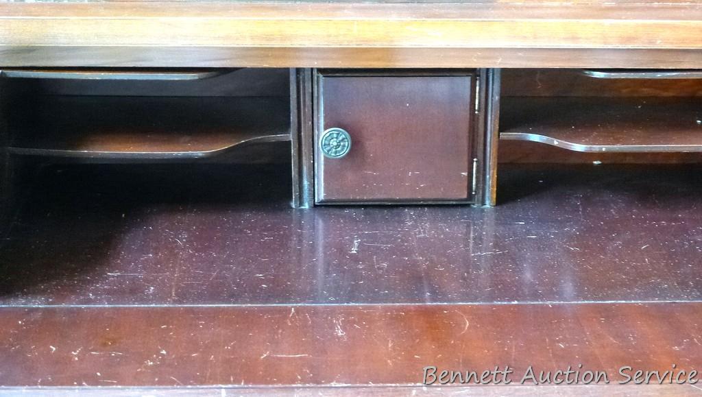 Beautiful antique china hutch is in good condition, glass and trim are intact. Measures 6'8" high x