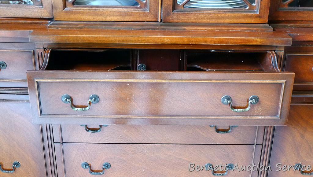 Beautiful antique china hutch is in good condition, glass and trim are intact. Measures 6'8" high x