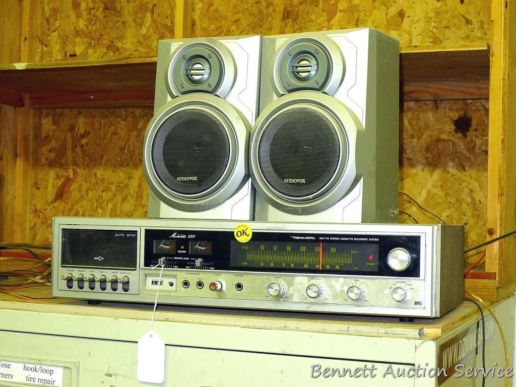 Realistic AM/FM stereo cassette recorder system is 22" x 11" x 5". Comes with 2 AudioVox speakers.