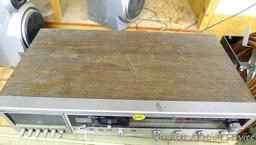 Realistic AM/FM stereo cassette recorder system is 22" x 11" x 5". Comes with 2 AudioVox speakers.