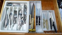 Stainless steel flatware set, plus two Pampered Chef knives and some other knives.