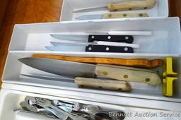 Stainless steel flatware set, plus two Pampered Chef knives and some other knives.