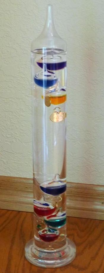 Galileo thermometer is in very good condition. Stands 14-1/2" tall.