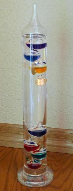 Galileo thermometer is in very good condition. Stands 14-1/2" tall.