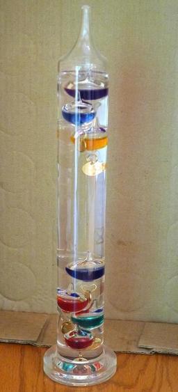 Galileo thermometer is in very good condition. Stands 14-1/2" tall.