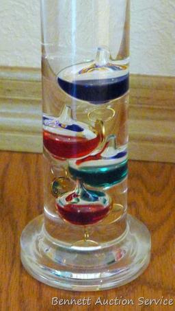 Galileo thermometer is in very good condition. Stands 14-1/2" tall.