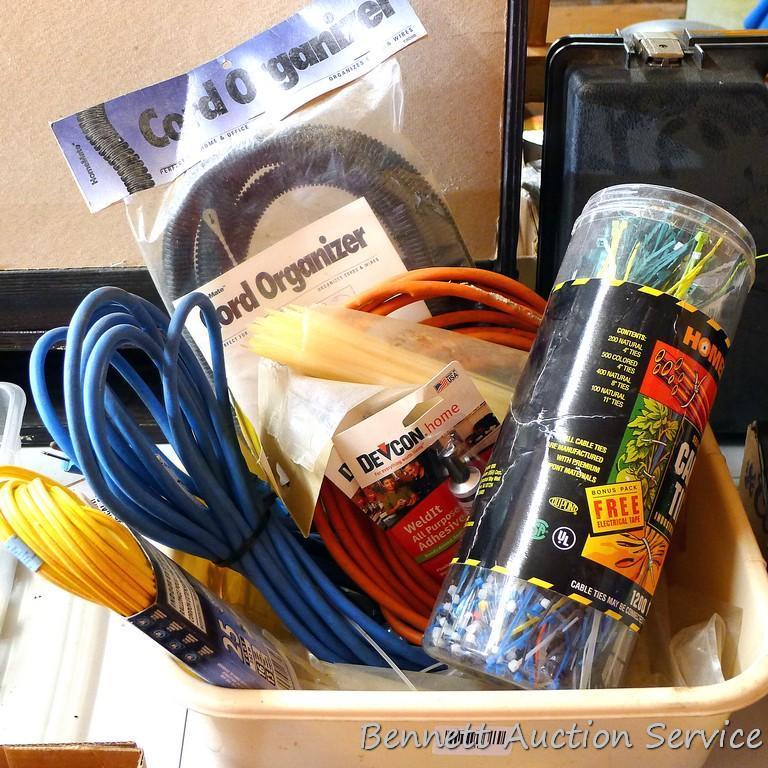 Three extension cords; 8 ft. flexible cord organizer; 2 new pkgs. Weld It all purpose adhesive; lots