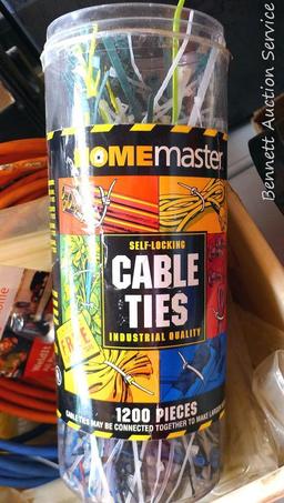 Three extension cords; 8 ft. flexible cord organizer; 2 new pkgs. Weld It all purpose adhesive; lots