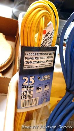 Three extension cords; 8 ft. flexible cord organizer; 2 new pkgs. Weld It all purpose adhesive; lots