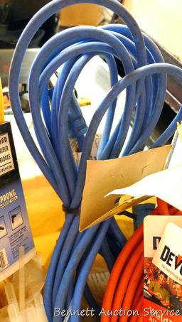 Three extension cords; 8 ft. flexible cord organizer; 2 new pkgs. Weld It all purpose adhesive; lots