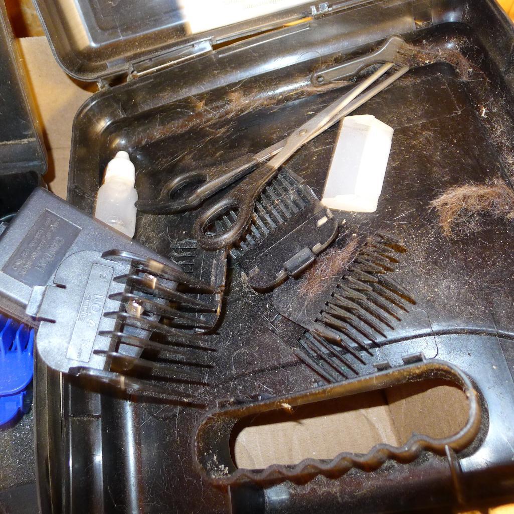 Andis and Wahl pet trimmers or clippers, both run. Wahl trimmer makes a popping sound when started.