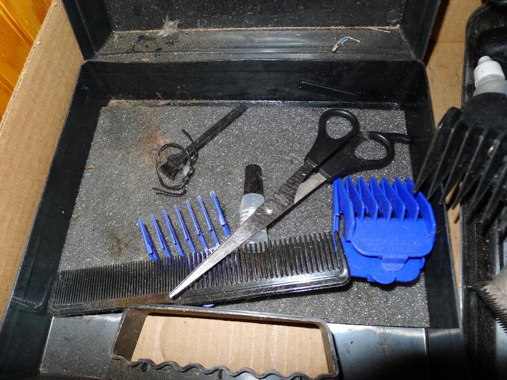 Andis and Wahl pet trimmers or clippers, both run. Wahl trimmer makes a popping sound when started.