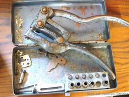 Whitney No. 4-B Metal hole punch is 8-1/4" long. Comes with metal case and several sizes of hole