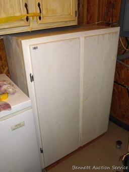 Storage cabinet could be wall mounted and is handy for garage, basement, etc. Measures approx. 51"