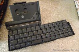 Palm wireless keyboard, Radio Shack radio, Sio Scan atomic clock, Panasonic phone base, more.
