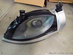 Hamilton Beach iron has retractable cord. Heats up, model No 14210.