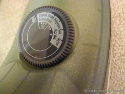 Hamilton Beach iron has retractable cord. Heats up, model No 14210.