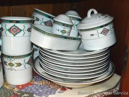 Set of dishes for 8 includes 12" platter, 11" plates, 6-1/2" saucers, 3-3/4" mugs, 3" cups, 8"