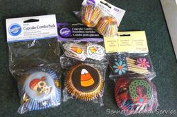 Pampered Chef miniature cookie cutters in metal box 3-1/2" x 6"; lots of decorative baking cups;