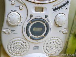 Set of three canisters, one filled with bars of soap, plus a Spectra radio/compact disc player. Disc