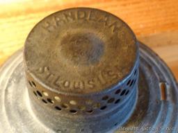 Handlan No 2000 lantern is marked C-O Co St Louis U.S.A. Has been turned in to a candle holder as