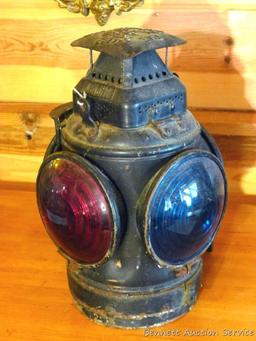 Adlake four-way railroad lantern is marked "The Adlake Non-Sweating Lamp Chicago". Two blue lenses