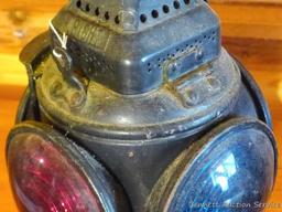 Adlake four-way railroad lantern is marked "The Adlake Non-Sweating Lamp Chicago". Two blue lenses