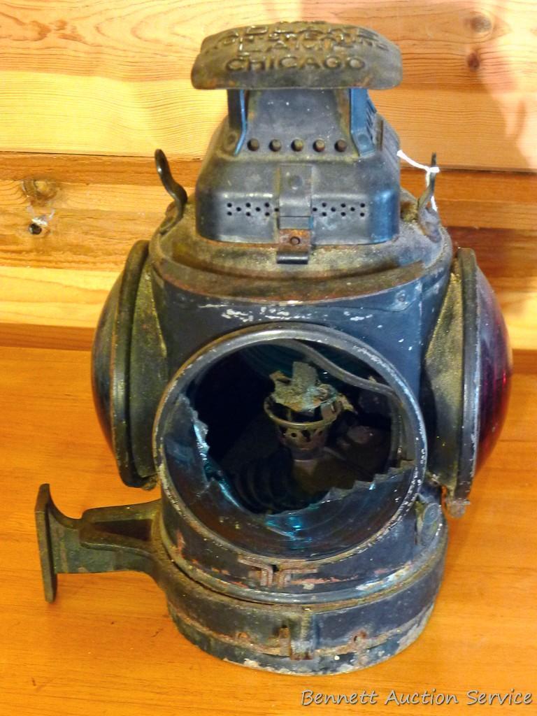 Adlake four-way railroad lantern is marked "The Adlake Non-Sweating Lamp Chicago". Two blue lenses
