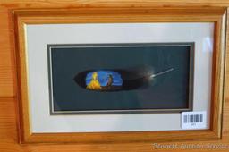 Pretty framed and matted feather has been painted with a Native American scene. Approx 15" x 10"
