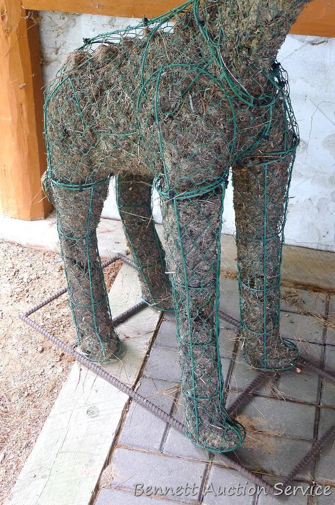 Handcrafted giraffe topiary form has a rebar base, stands 52" tall.