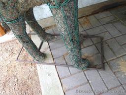 Handcrafted giraffe topiary form has a rebar base, stands 52" tall.