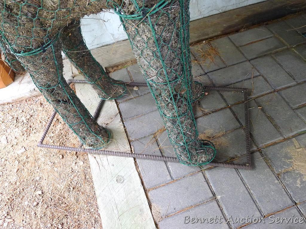 Handcrafted giraffe topiary form has a rebar base, stands 52" tall.
