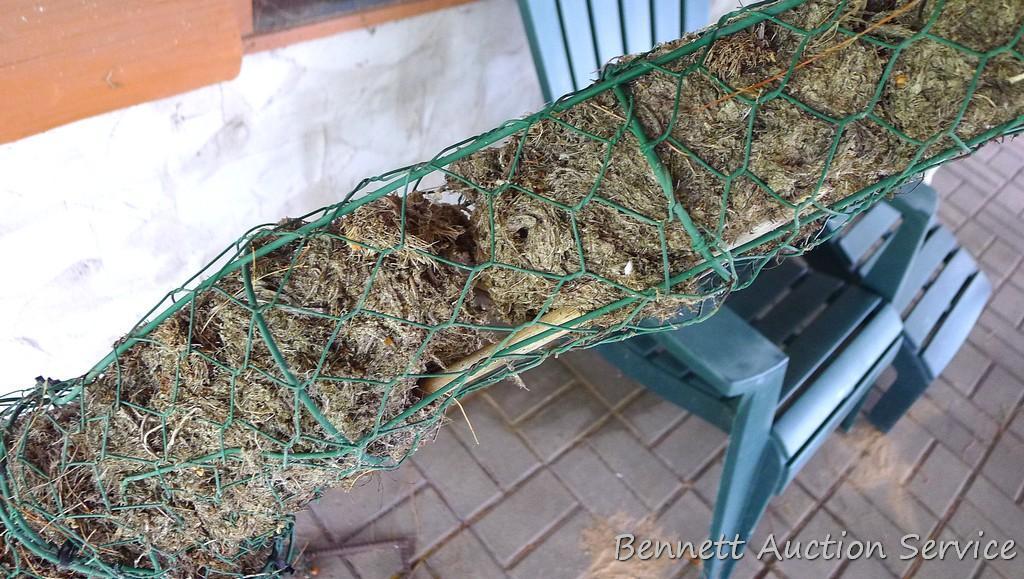 Handcrafted giraffe topiary form has a rebar base, stands 52" tall.
