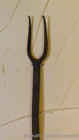 Unique primitive cooking utensil has what may be a flipper on one end and a fork on the other, 17";