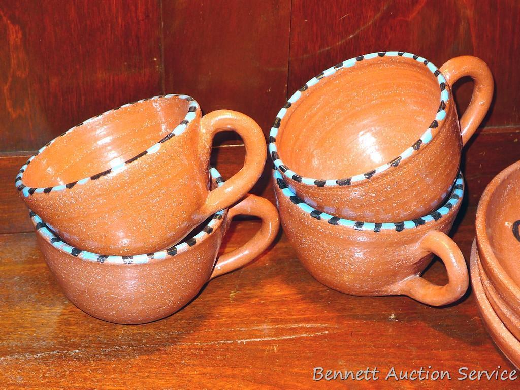 Twelve pcs. of Southwestern style dinnerware by Irene Gimeno. One piece has a repair on it, but all