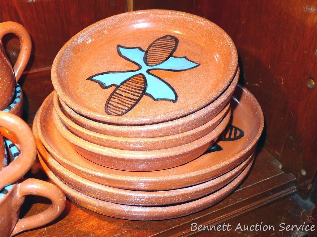 Twelve pcs. of Southwestern style dinnerware by Irene Gimeno. One piece has a repair on it, but all