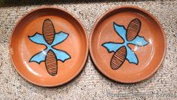 Twelve pcs. of Southwestern style dinnerware by Irene Gimeno. One piece has a repair on it, but all