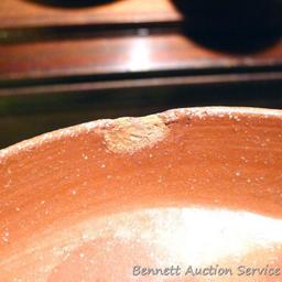 Twelve pcs. of Southwestern style dinnerware by Irene Gimeno. One piece has a repair on it, but all