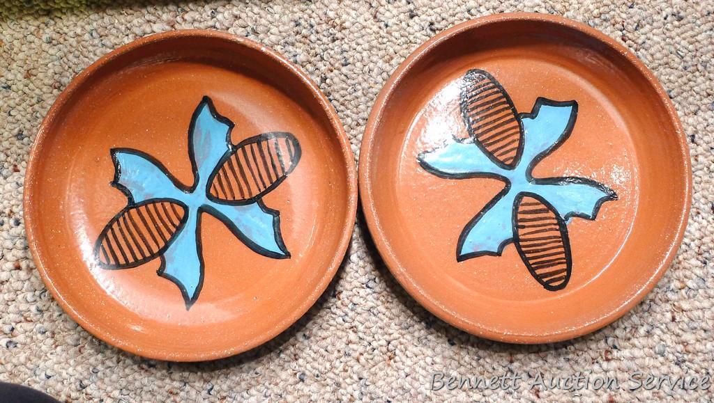 Twelve pcs. of Southwestern style dinnerware by Irene Gimeno. One piece has a repair on it, but all