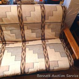 Wood framed futon is about 7" x 3" x 3' tall when set up as a couch. Whole piece look to be in nice